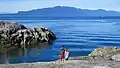 A couple on a rocky beach
