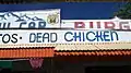 Sign along the roof advertising the "Dead Chicken" menu item