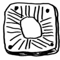 Reproduction of a sun-like carving from the castro