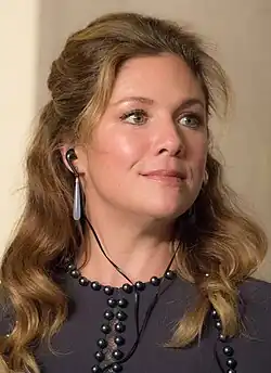 Grégoire smiling and wearing headphones