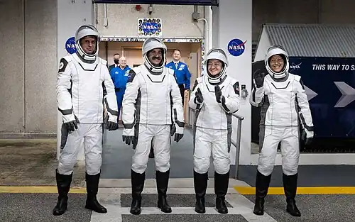 Crew-12 astronauts outside the O&C Building