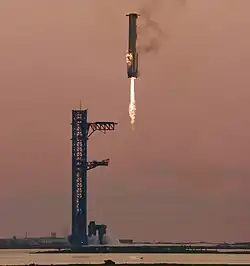 Booster 12 descending towards the launch tower