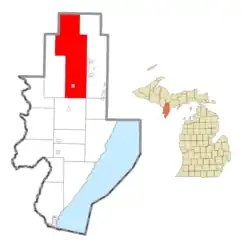Location within Menominee County (red) and the state of Michigan; administered village of Powers in pink