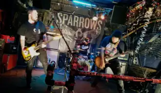 Sparrows performing in Toronto, Ontario in 2018. From left to right: Dan Thomson, Jon Busby, and Justin Sears.