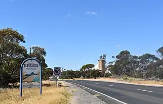 Entering Speed from the north via the Sunraysia Highway, 2018. Note the sign reads "Welcome to Speed. Please slow down"