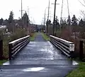 This straight portion parallels Johnson Creek Blvd. and crosses many intersecting streets.