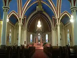 Church with high vaulted ceiling supported by columns