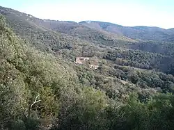 The hamlet of Saint-Jean seen from the trail leading to the dolmen of Balma de Na Cristiana