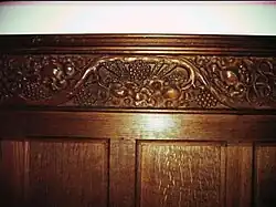 Carving of wheat and grapes in St John the Evangelist Church, Bury, Sussex.