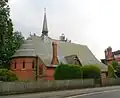 St Saviour's Church, Dry Hill Park Road, Tonbridge, Kent, 1875–76, a typical red brick lancet church by Ewan Christian with deep apse, steep pitched roof and a fleche[164]