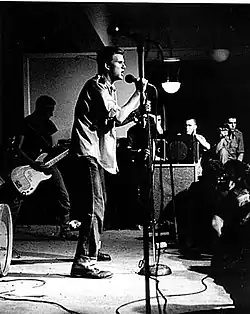 Members John Stabb (center) and Brian Gay (left) of Government Issue performing at the Wilson Center in April 1981