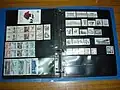 Ring-binder of loose-leaf stock pages storing stamp booklets and booklet panes