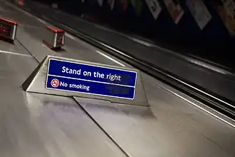 Signage on the London Underground instructing people to stand on the right.
