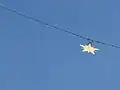 Close-up of the golden star hanging over Moustiers-Sainte-Marie