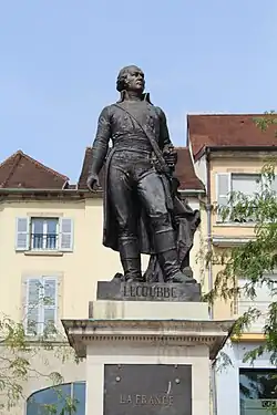 The general stands upon a marble plinth, he is looking out into the distance with his hand upon his sword hilt. His name is carved in the base and the inscription lower reads "A general of France" (translated).