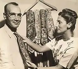 Stephen and Ayne Sacklarian with hand-painted ties at artist exhibition