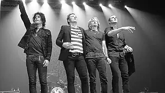Stone Temple Pilots' original lineup in Manila, Philippines, in March 2011. From left to right: Dean DeLeo, Scott Weiland, Eric Kretz, and Robert DeLeo.
