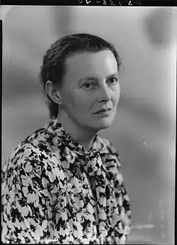 Sad, middle-aged woman dressed in flower top