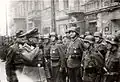 Jürgen Stroop inspecting a parade of SS soldiers during Warsaw Ghetto Uprising Depicted place right to left: Zamenhofa 15, Zamenhofa 13