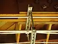 An overhead electrical wire hanger manufactured from two lengths of strut channel and two lengths of threaded rod