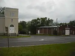 A view of Stull looking southwest. The building on the left is the Stull United Methodist Church, and the building on the right is the fire station.