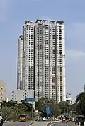 A residential skyscraper complex with a white painted exterior.