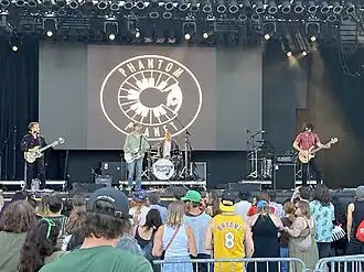 Phantom Planet performing at Summerfest 2025. From left to right: Lead guitarist Darren Robinson, frontman/rhythm guitarist Alex Greenwald, drummer Andrew Parker, and substitute bassist Chris Lorentz.