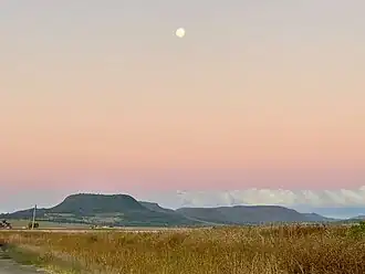 Sunset and moonrise over Main Range National Park seen from Clintonvale, Queensland, 2021