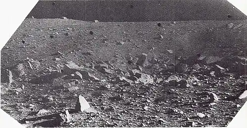 Angular blocks, up to 7 feet (2 meters) in diameter, which form part of a strewn field of blocks that surround a sharp-rim crater 10 feet (3 meters) in diameter