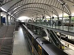 Olympic Park station in Sydney. All passengers alight on the island platform and board from the significantly wider outer platforms during major events.