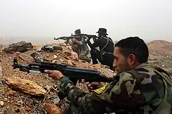 Soldiers aiming in a trench