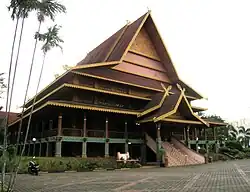 A Grand Malay derived from the Lipat Kajang style and extended with Limas roof style, Riau Pavilion, Taman Mini Indonesia theme park. This style of structure is often used in palace architecture of Malay kings, and in government buildings.