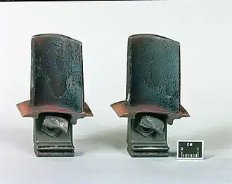 The rough turbine blade airfoil surfaces have a higher friction coefficient than smooth surfaces and cause friction drag which is a source of loss in the turbine.[153]