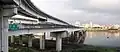 Taipei Bridge seen from Sanchong in 2008 The lower bridge is the eastbound motorcycle/bicycle/pedestrian bridge and the upper one is an entrance ramp from Huánhé Road (環河南路)