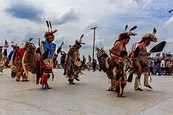 People of the Meskwaki nation dancing in a Pow Wow.