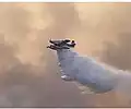 An air tanker releases water over the fire on July 22.