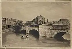 A stone bridge with three arches