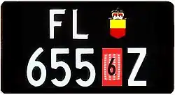 Temporary customs number plate for uncleared motor vehicles, rear plate in a square format.