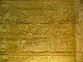 Ptolemy III and Seshat, with Horus alongside, depicted conducting the "stretching of the cord". Bas-relief in the Temple of Edfu (c. 237–57 BC), Ptolemaic dynasty.
