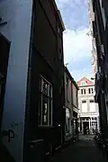 View from the Schoutensteeg, a side alley looking West towards the Barteljorisstraat