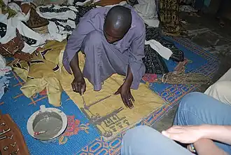 Image 47A textile artisan at work in Djenne, Mali. (from Culture of Mali)