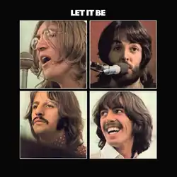 A black cover with four square photos of the band members' faces