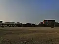 The Cricket Ground overlooking the Male Hostel 7 (M7) and the Aquatic Center