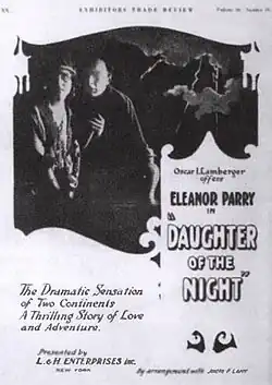 A man and a woman stand next to one another in a black and white movie poster