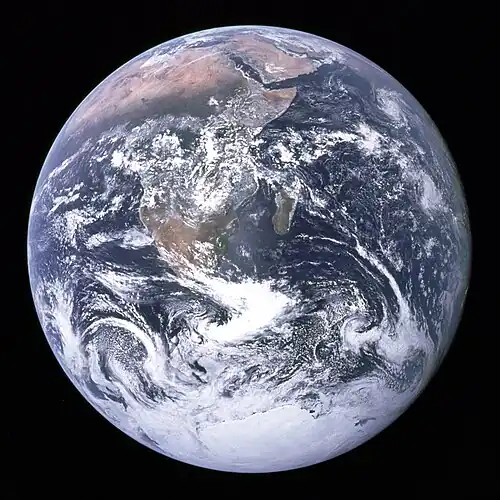 Image 18 The Blue Marble Photo credit: The Apollo 17 crew The Blue Marble is a famous photograph of Earth. NASA officially credits the image to the entire Apollo 17 crew — Eugene Cernan, Ronald Evans and Jack Schmitt — all of whom took photographic images during the mission. Apollo 17 passed over Africa during daylight hours and Antarctica is also illuminated. The photograph was taken approximately five hours after the spacecraft's launch, while en route to the Moon. Apollo 17, notably, was the last manned lunar mission; no humans since have been at a range where taking a "whole-Earth" photograph such as "The Blue Marble" would be possible. More selected pictures