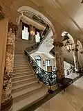 View of the main stair at the first floor, facing southeast, 2025