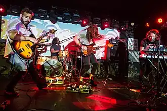 The Tins performing at Mercury Lounge in July 2018. From Left To Right: Adam Putzer, David Muntner, Justin John Smith, and Michael Santillo