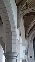 Stone arch and wooden roof supports