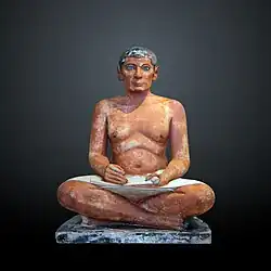 The Seated Scribe; 2613–2494&nbsp;BC; painted limestone and inlaid quartz; height: 53.7&nbsp;cm; Louvre