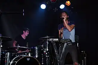 These Arms Are Snakes performing live in Barcelona. Visible are vocalist Steve Snere and drummer Chris Common.